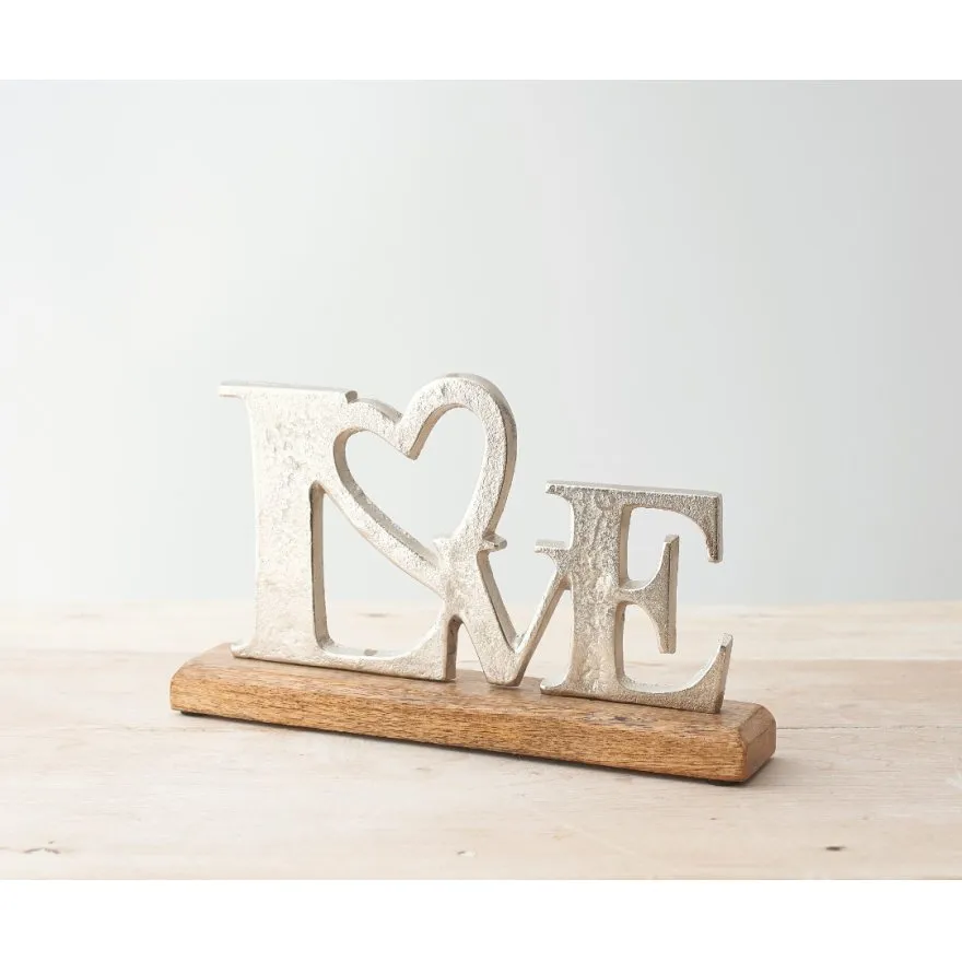 Love sign on wood base